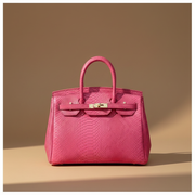 Héritage, sac rétro en cuir de vachette grain reptile, coloris Fuchsia