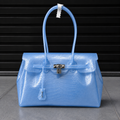 Jelly Croco Azure — sac jelly bleu effet croco en TPU translucide