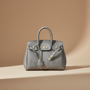 Héritage, sac rétro en cuir de vachette grain reptile, coloris Gris